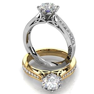 Round Brilliant Cut Solitaire Diamond Engagement Ring, 6 Button Claws Set on Tapered Bead Set Band with Patterned Undersetting.