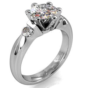 Round Brilliant Cut Diamond Trilogy Engagement Ring, Stones 6 Claw Set with Tension Set Side Stones and a Diamond Set Classic Undersetting.
