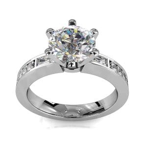 Round Brilliant Cut Solitaire Diamond Engagement Ring, 6 Claws Set with Tapered Baguette Side Stones on a Bead Set Straight Band.