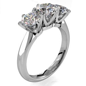 Round Brilliant Cut Diamond Trilogy Engagement Ring, Stones 6 Claw Set with a Classic Crown Undersetting.