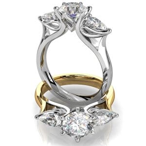 Round Brilliant Cut Diamond Trilogy Engagement Ring, Stones 6 Claw Set with Pear Side Stones on a Tapered Flat Band with Lotus Flower Undersetting.