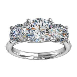 Round Brilliant Cut Diamond Trilogy Engagement Ring, Stones 4 Claw Set on a Tapered Band with Undersweep Setting.