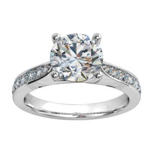 Round Brilliant Cut Solitaire Diamond Engagement Ring, 4 Button Claws Set on a Tapered Bead Set Band with Crossover Undersetting.
